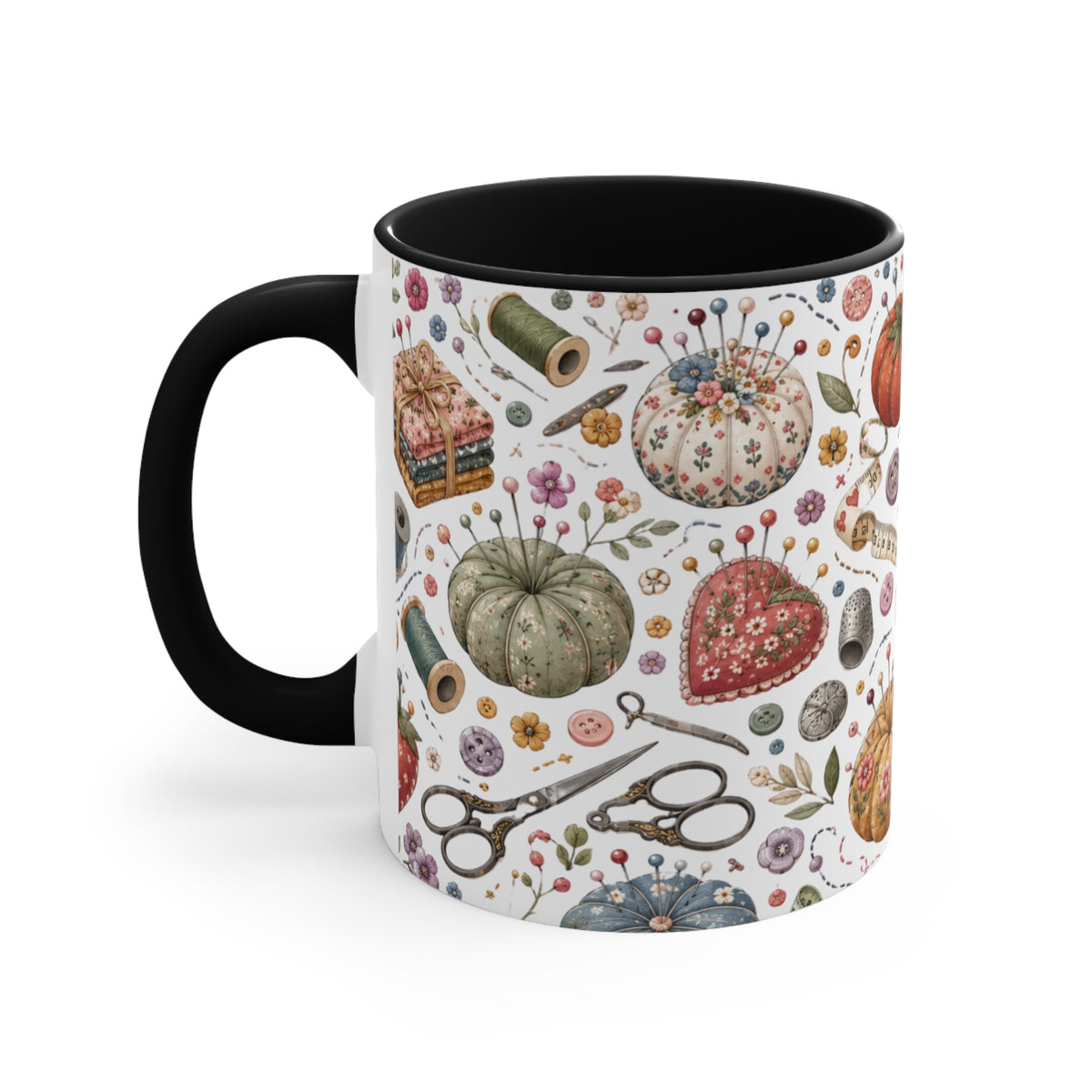 A white ceramic mug with a black interior, decorated with vintage-style sewing and craft illustrations, including  pincushions, scissors, and thread spools, with a black handle and interior.