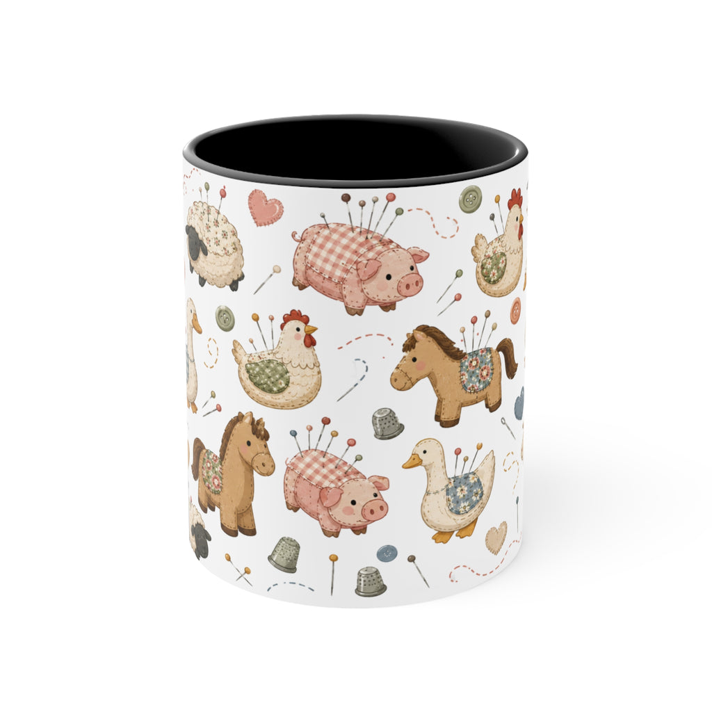 A white ceramic mug with a black handle and interior, decorated with a whimsical pincushion animals including chickens, pigs, ducks, horses, sheep, and goats. The mug is shown from the front and the handle in not visible.
