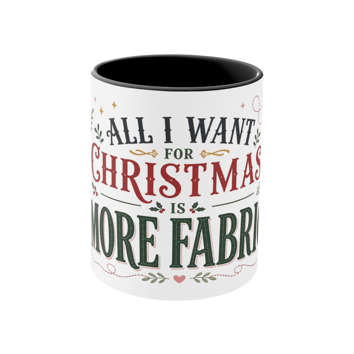 The front of a white ceramic mug with a black interior, featuring a festive Christmas-themed graphic that reads 'ALL I WANT FOR CHRISTMAS IS MORE FABRIC' in dark green and red lettering with small decorative accents.