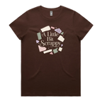 A dark brown short-sleeve crewneck t-shirt featuring a circular graphic on the chest with the text 'A Little Bit Scrappy' surrounded by small colorful fabric pieces.