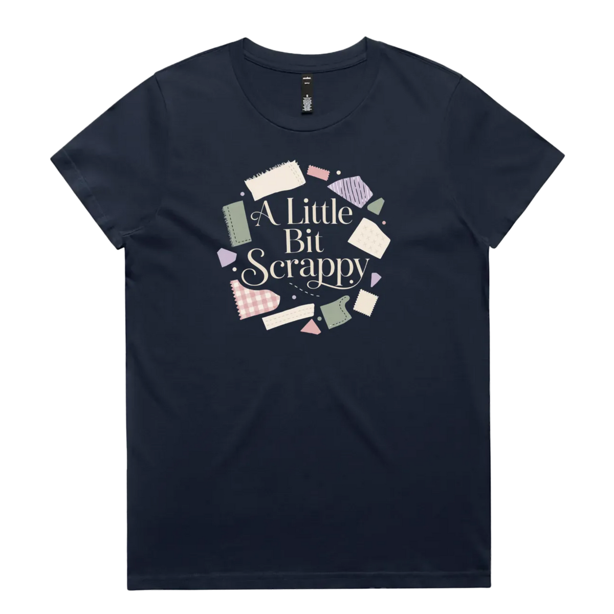 A midnight blue short-sleeve crewneck t-shirt featuring a circular graphic on the chest with the text 'A Little Bit Scrappy' surrounded by small colorful fabric pieces.