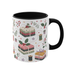 The right side of a white ceramic mug with a black handle and interior, decorated with a repeating pattern of stacked fabrics, holly leaves, berries, and thread spools in soft pink, green, beige, and brown tones.