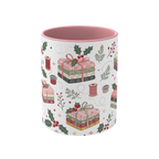 The front of a white ceramic mug with a pink interior, decorated with a repeating pattern of stacked fabrics, holly leaves, berries, and thread spools in soft pink, green, beige, and brown tones.