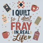 A square graphic design with the text 'I Quilt So I don't Fray in Real Life' in decorative serif and script fonts, surrounded by quilted fabric spools, two coffee mugs with hearts, stars, and fabric sale tags on a powder blue background.