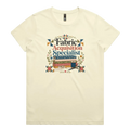 A pale butter yellow crewneck short-sleeve t-shirt with the words 'Fabric Acquisition Specialist' above a stack of fabric bolts, a measuring tape, thread spool and scissors.