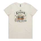 A cream crewneck, short-sleeved t-shirt with the vintage style graphic 'Keeper of the Fabric Stash'.