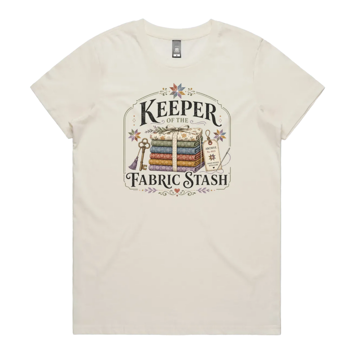 A cream crewneck, short-sleeved t-shirt with the vintage style graphic 'Keeper of the Fabric Stash'.