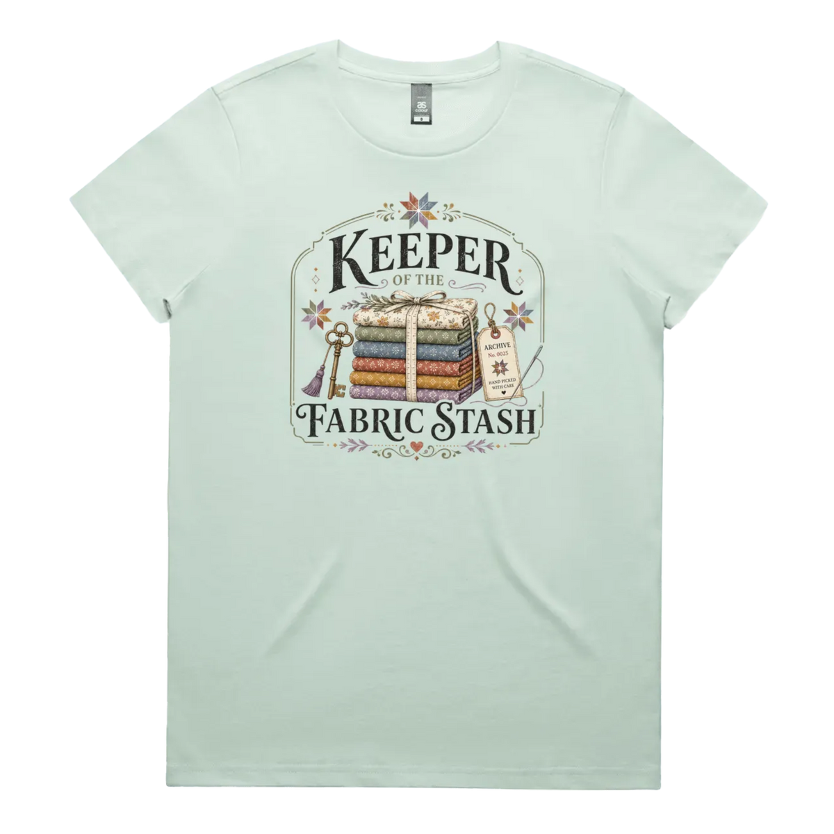 A pale mint green crewneck, short-sleeved t-shirt with the vintage style graphic 'Keeper of the Fabric Stash'.