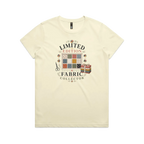 A pale butter yellow short-sleeve crewneck t-shirt featuring the text 'Limited Edition Fabric Collector' surround a fabric swatch board, a tied bundle of fabric and scissors.