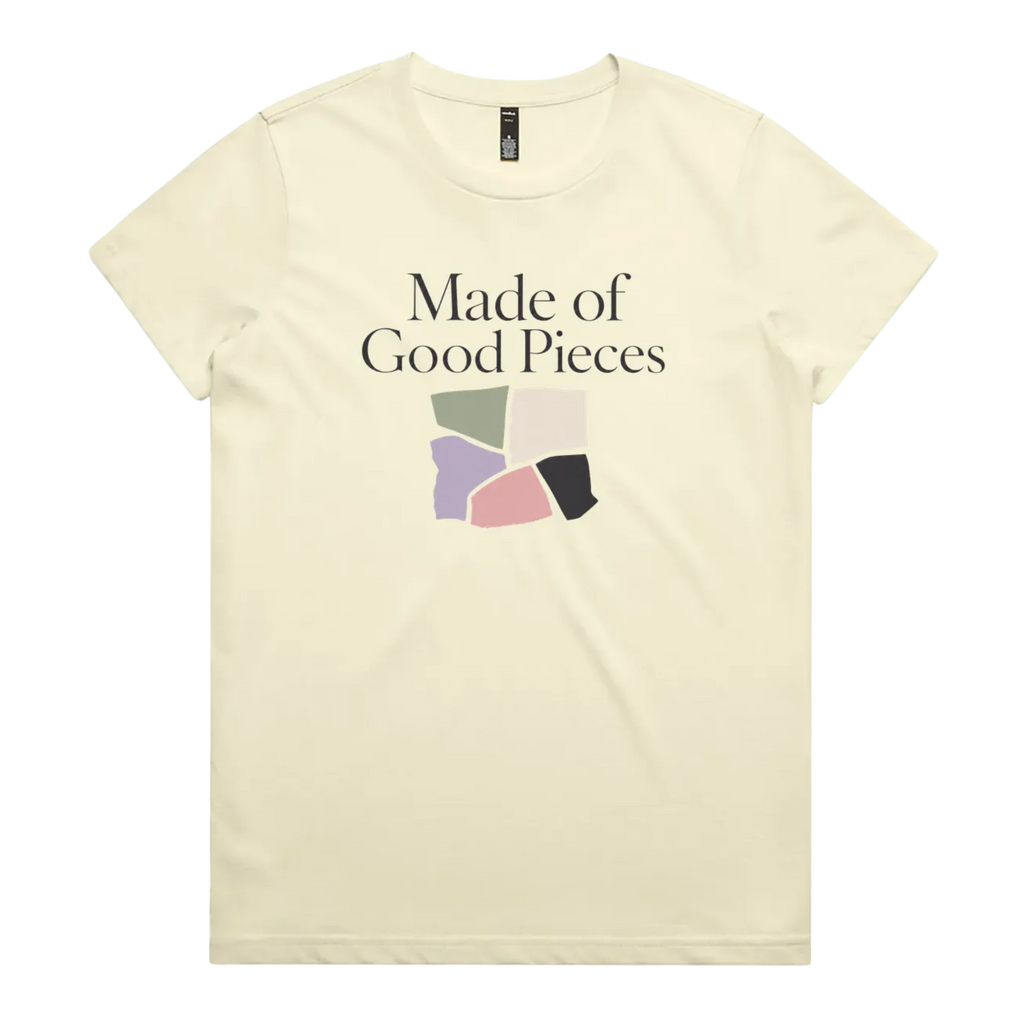 A very pale yellow short-sleeve t-shirt with the text 'Made of Good Pieces' above an image of uneven fabric swatches in sage, cream, mauve pink and black.