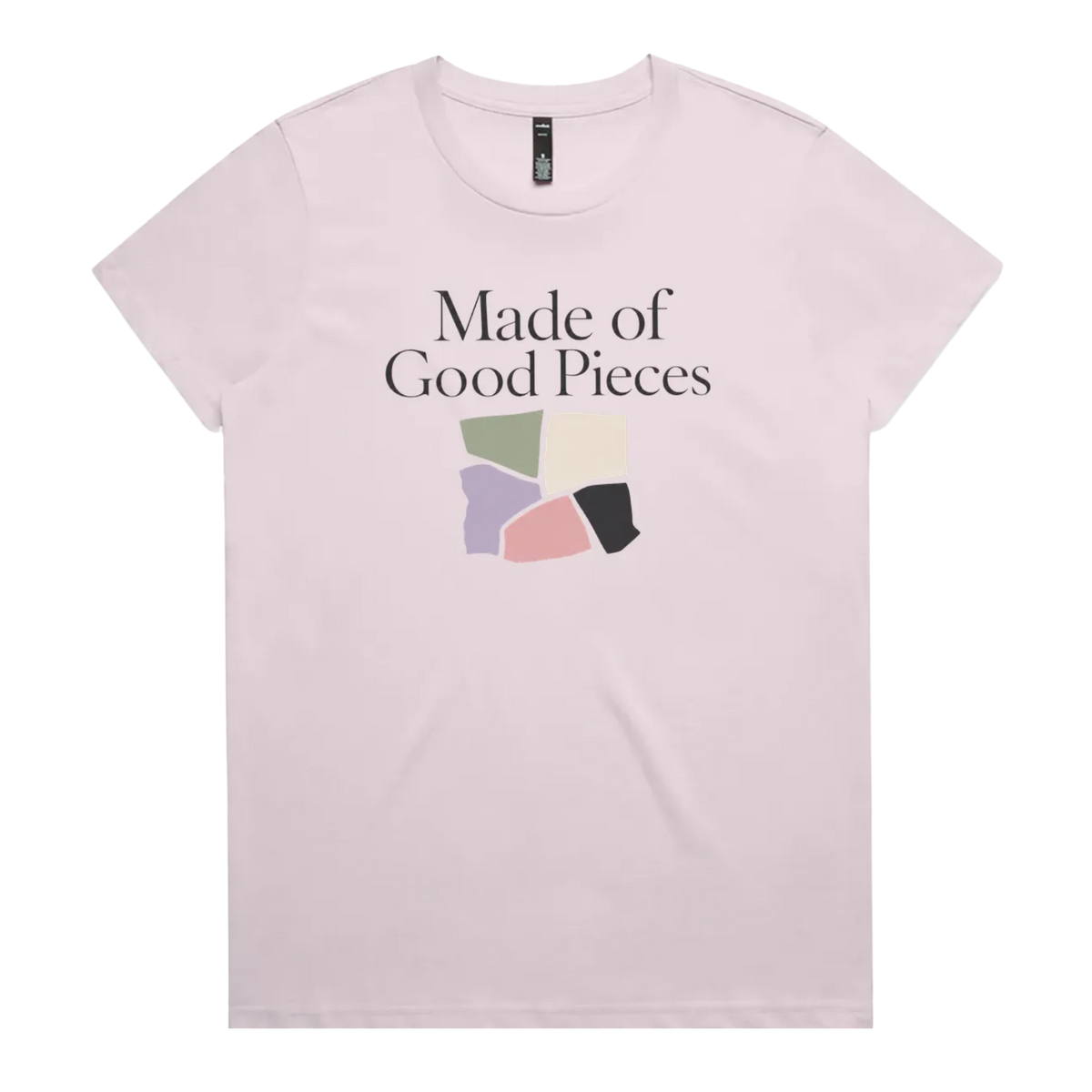 A pale mauve short-sleeve t-shirt with the text 'Made of Good Pieces' above an image of uneven fabric swatches in sage, cream, mauve pink and black.