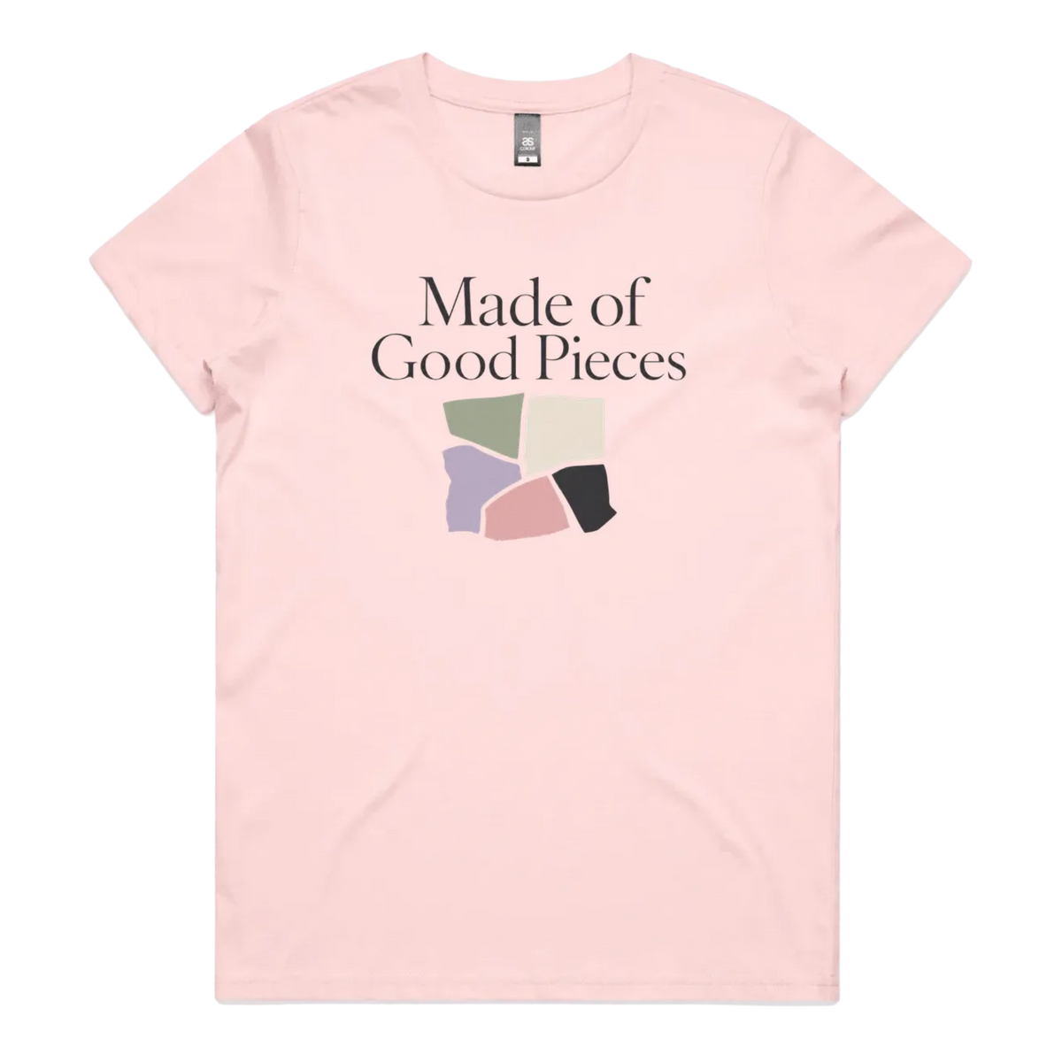 A pale pink short-sleeve t-shirt with the text 'Made of Good Pieces' above an image of uneven fabric swatches in sage, cream, mauve pink and black.