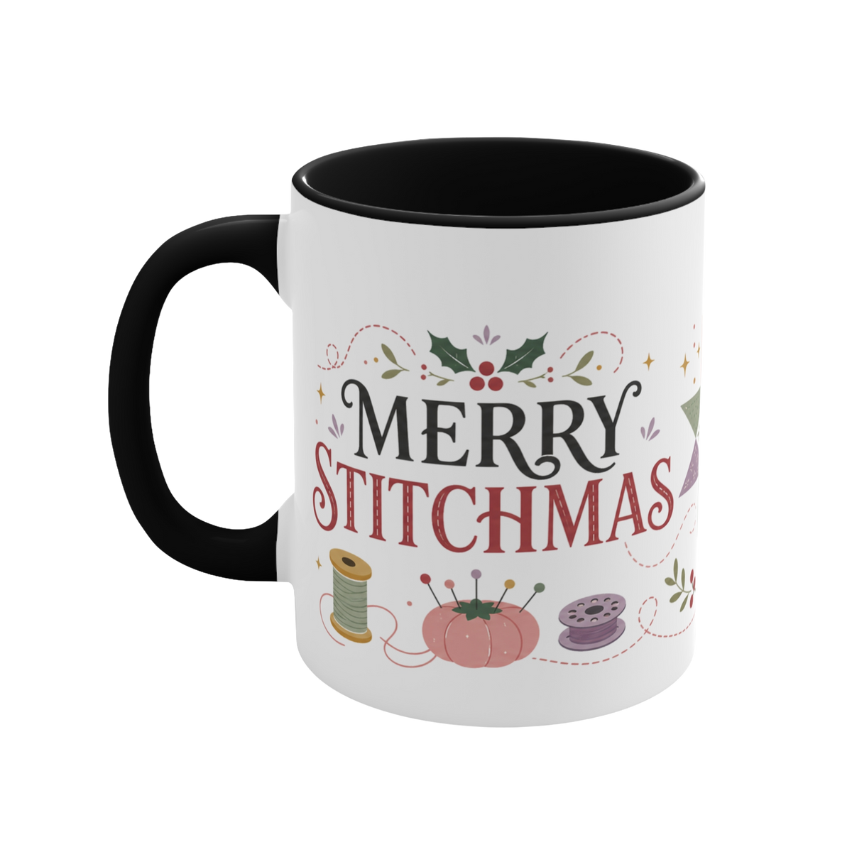 The left side of a white ceramic mug with a black handle and interior, decorated with a bobbin, thread spool,  pincushion and holly and the text ‘Merry Stitchmas’.