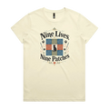 A light butter yellow short-sleeve t-shirt with a colorful graphic on the front that reads 'Nine Lives, Nine Patches' around a nine patch quilt block with a black cat silhouette in the middle.
