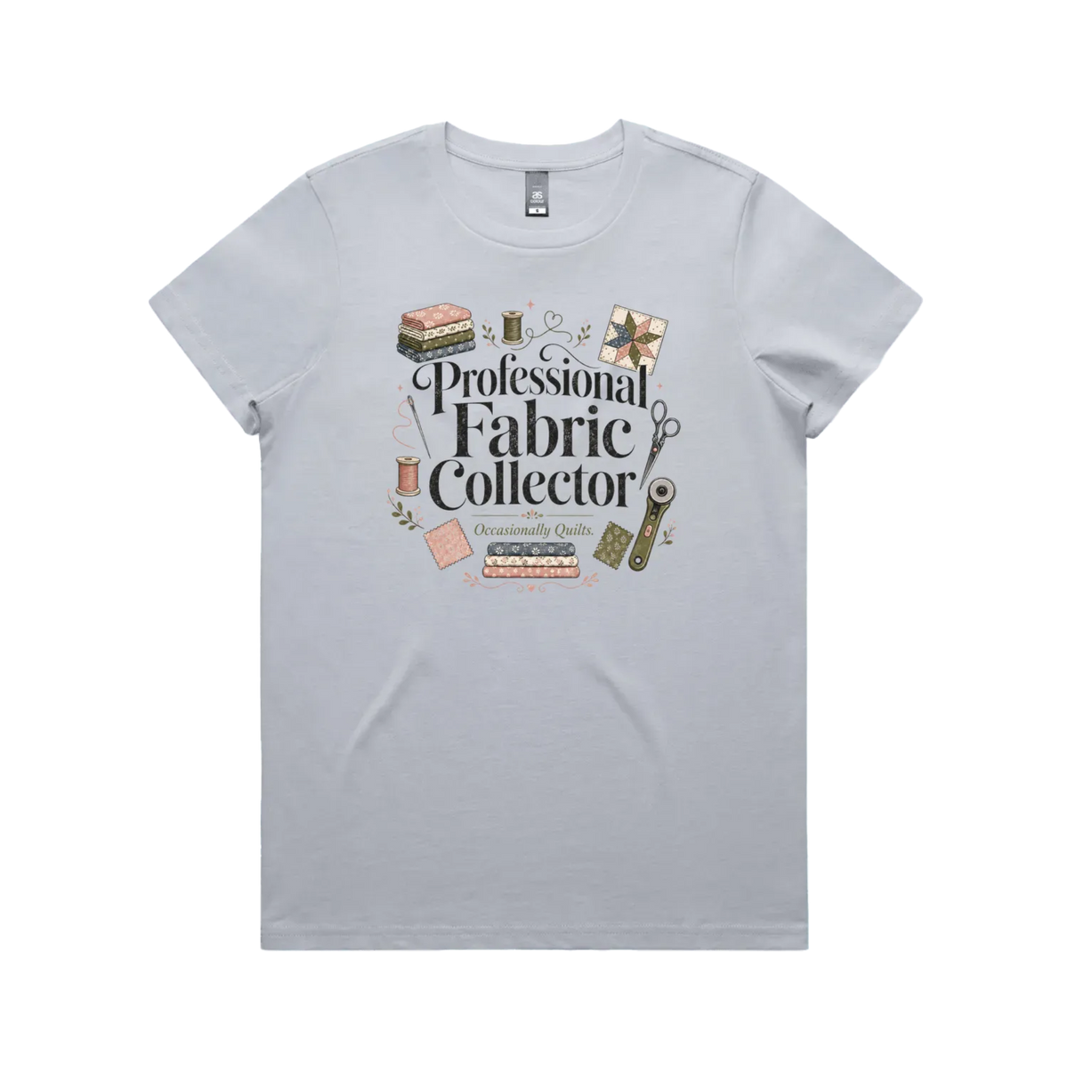 A powder blue short-sleeve crewneck t-shirt with the words 'Professional Fabric Collector' surrounded by fabric bundles, swatches, thread and a patchwork star.
