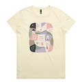 A very pale yellow short-sleeve crewneck t-shirt featuring a central square graphic with a patchwork design of pastel-colored home-themed illustrations and the text 'Pieces of Home'.