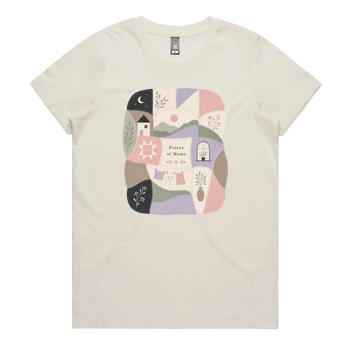 A light cream short-sleeve crewneck t-shirt featuring a central square graphic with a patchwork design of pastel-colored home-themed illustrations and the text 'Pieces of Home'.