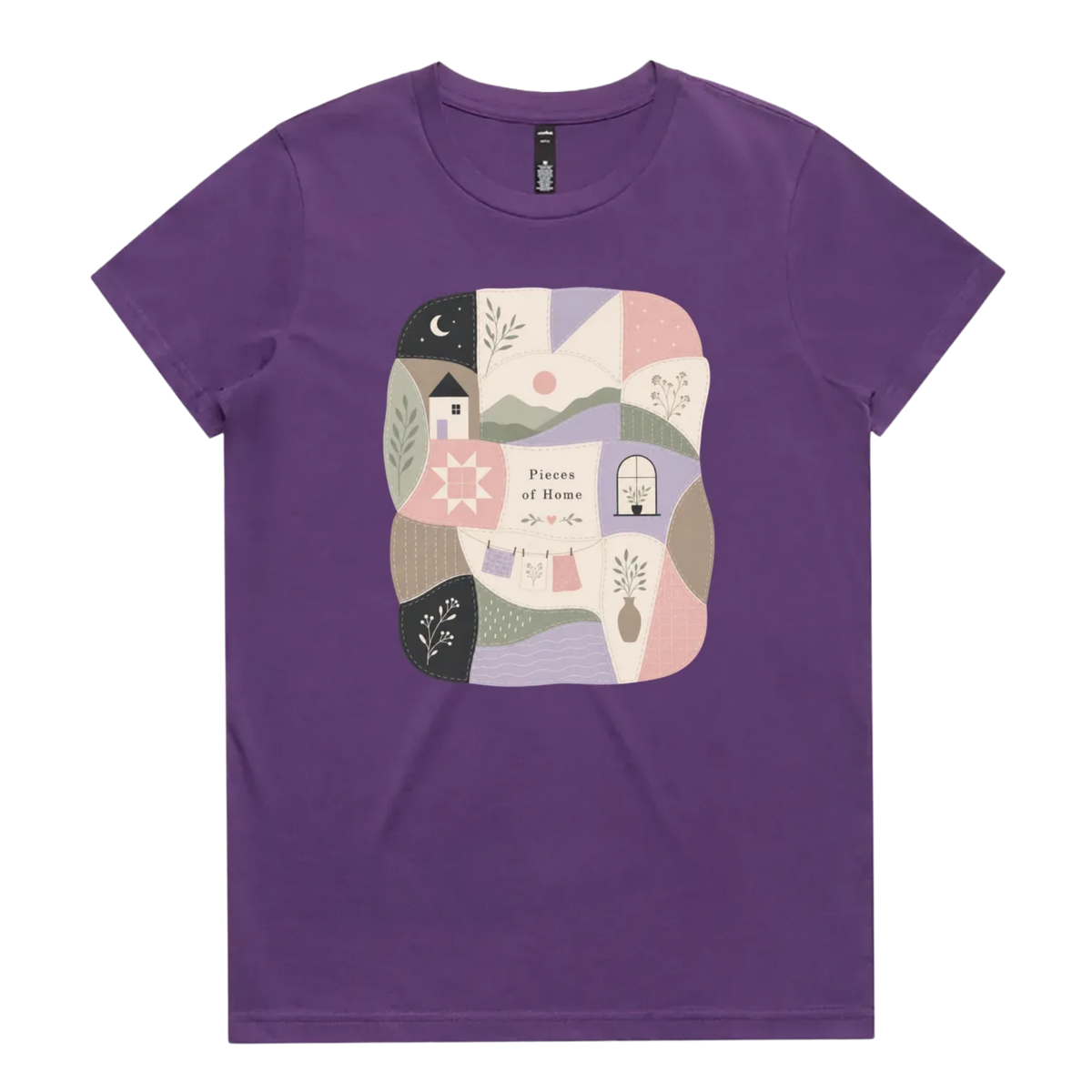 A purple short-sleeve crewneck t-shirt featuring a central square graphic with a patchwork design of pastel-colored home-themed illustrations and the text 'Pieces of Home'.