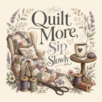 A detailed image of the 'Quilt More, Sip Slowly' graphic showing a vintage style armchair with a quilt draped over it, a small coffee table with a mug of coffee and pincushion. The design also includes flowers, thread spools and a pair of scissors.