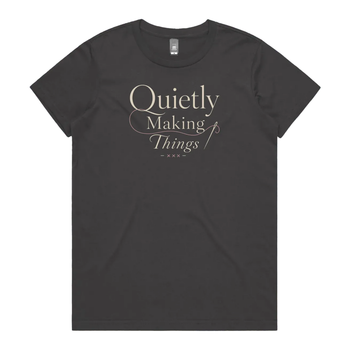 A dark charcoal grey short-sleeve crewneck t-shirt featuring a cream-colored graphic print on the front that reads 'Quietly Making Things' in an elegant serif and script font with needle and thread accents.