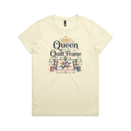 A pale butter yellow short-sleeve t-shirt with a graphic print on the front that reads 'Queen of the Quilt Frame' in black script, decorated with a gold crown, a quilt design, and spools of thread.