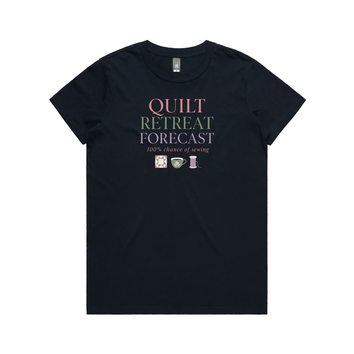 A navy blue short-sleeve crewneck t-shirt featuring a graphic print on the front that reads 'QUILT RETREAT FORECAST, 100% chance of sewing' in pink, green, and white lettering, with small sewing-themed icons below.