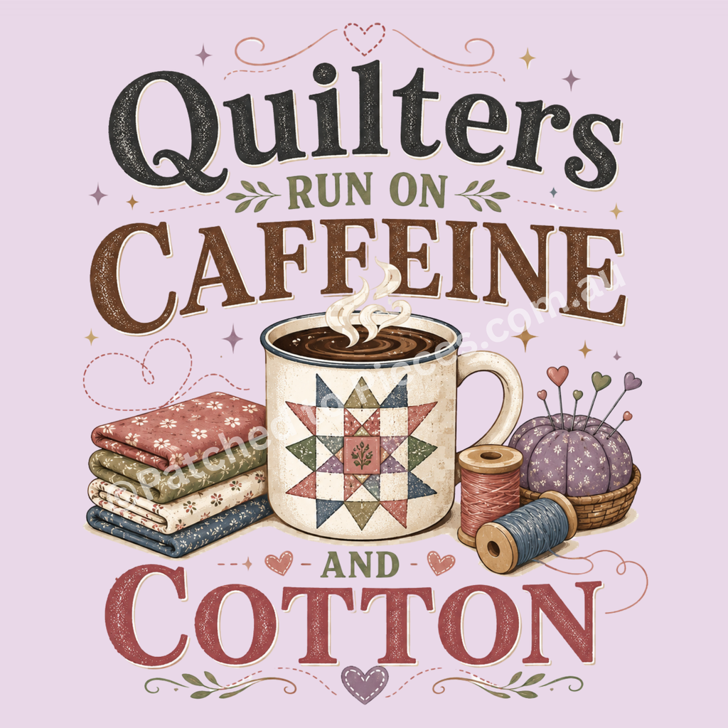 A detailed image of the graphic 'Quilters Run on Caffeine and Cotton' showing the words in black, green, brown and muted red. The mug in the middle has an image of a patchwork block on the front with a stack of folded fabric on the left and a pincushion and thread spools on the right.