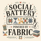 A detailed illustration of 'Social Battery Powered by Fabric' showing the words in black font and a battery filled with patchwork blocks. A thread spool, scissors, fabric bundle and small decorative leaves surround the words.
