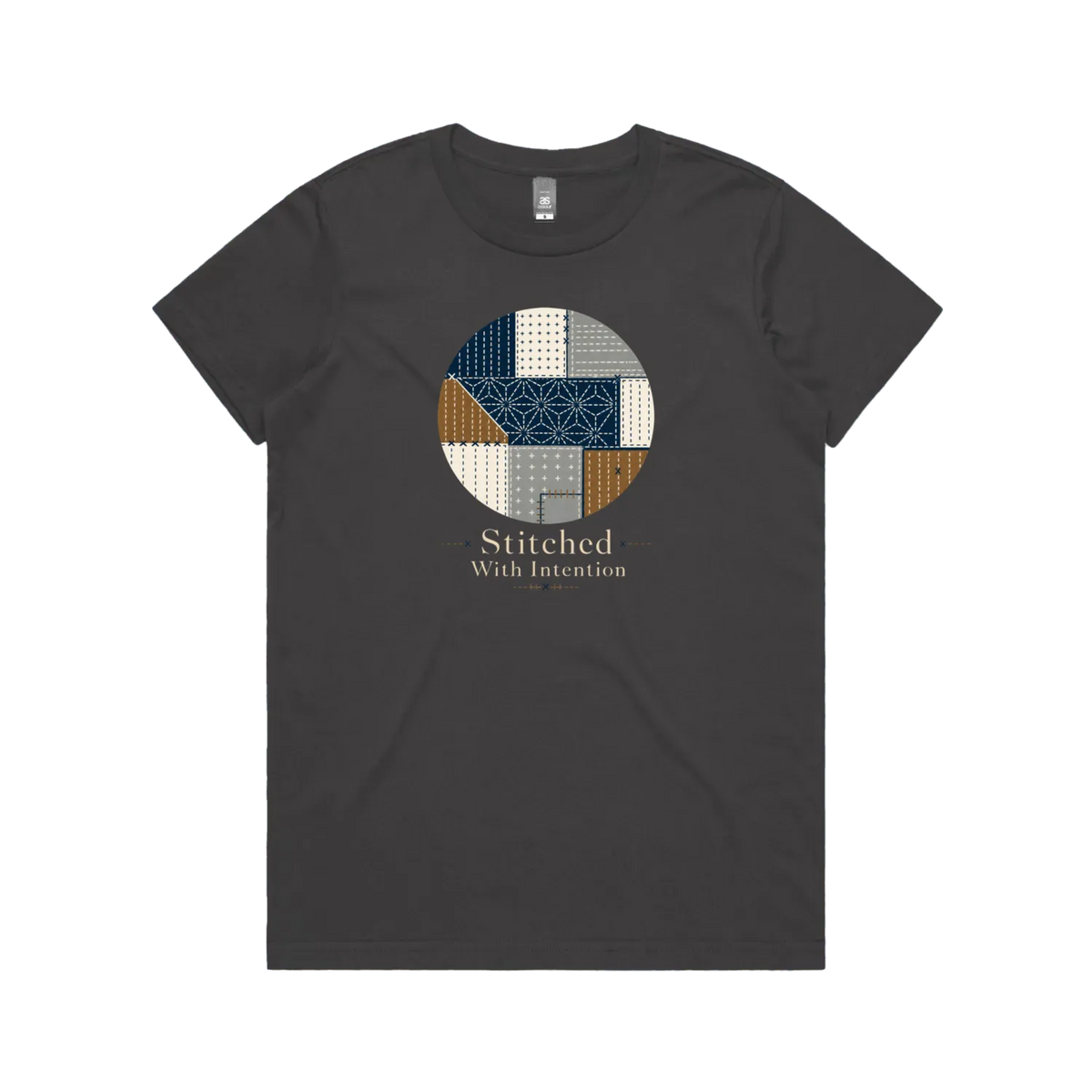 A charcoal grey short-sleeve crewneck t-shirt featuring a circular graphic on the chest with geometric sashiko stitched patterns in navy, beige, and brown, with the text 'Stitched With Intention' printed below.