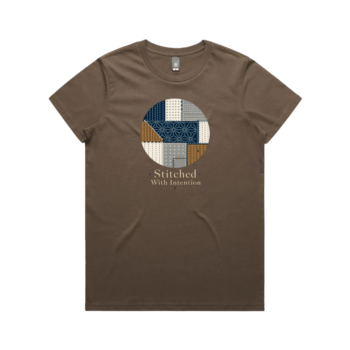 A walnut brown short-sleeve crewneck t-shirt featuring a circular graphic on the chest with geometric sashiko stitched patterns in navy, beige, and brown, with the text 'Stitched With Intention' printed below.