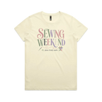 A pale butter yellow short-sleeve t-shirt with the words 'Sewing Weekend plans firmly made' across the front in multi-coloured letters.
