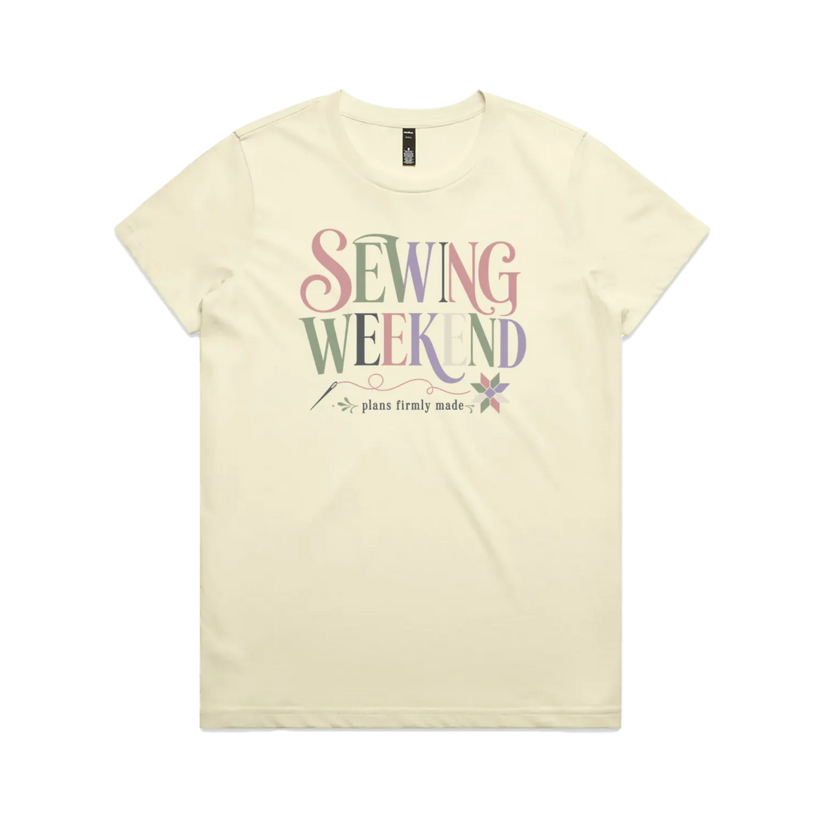 A pale butter yellow short-sleeve t-shirt with the words 'Sewing Weekend plans firmly made' across the front in multi-coloured letters.