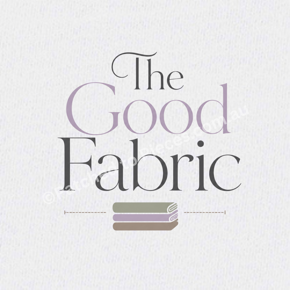 A close-uo of The Good Fabric image centered on a white textured background. The words 'the' and 'fabric' are printed in black with the word 'good' printed in lavender. A stack of folded fabric in sage, lavender and brown sits below the words.