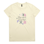 A pale yellow short-sleeve crewneck t-shirt featuring a central graphic with the words 'Threaded Together' in black script, surrounded by pastel geometric shapes in pink, purple, green, and beige.