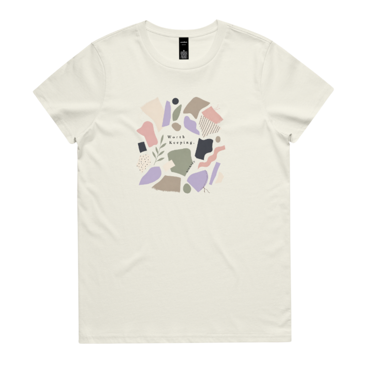 A light cream crewneck t-shirt featuring a central graphic of abstract pastel shapes in pink, purple, beige, and brown, with the text 'Worth Keeping' written in the center.