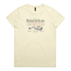 A pale butter yellow short-sleeve t-shirt with a vintage-style graphic on the chest reading 'WEEKEND PLANS: SORTED' above an illustration of a rotary cutter and tied fabric bundle, with 'fabric + friends + sewing' below.